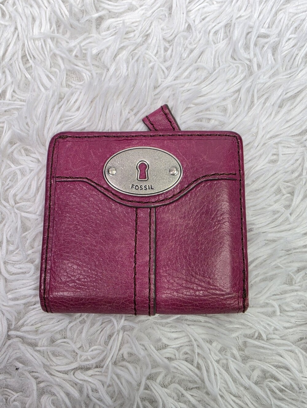 Fossil Magenta Leather Wallet with Signature Keyhole Plaque.